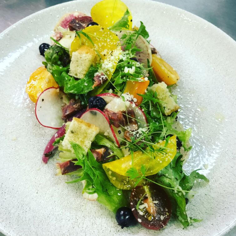A colorful assortment of fruits and vegetables beautifully presented on a white plate. A colorful assortment of fruits and vegetables beautifully presented on a white plate.