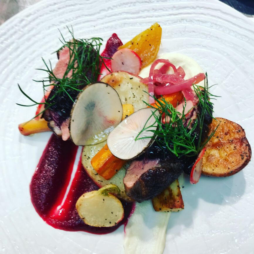 A beautifully presented plate containing meat, vibrant vegetables, and a flavorful sauce, ready to be enjoyed. A beautifully presented plate containing meat, vibrant vegetables, and a flavorful sauce, ready to be enjoyed.